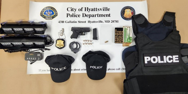 A police-style badge, a loaded handgun, ballistic vest, ammunition, handcuffs and apparel with "police" written on it were found in the suspect's car.