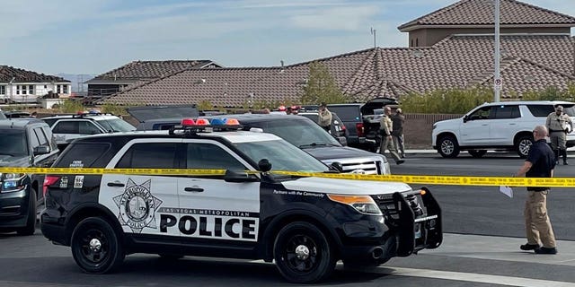 A SWAT team arrives to provide assistance as FBI agents negotiated with Matthew Beasley on March 3, 2022, in Las Vegas. Beasley was indicted Wednesday on federal charges that he orchestrated a $460 million Ponzi scheme.