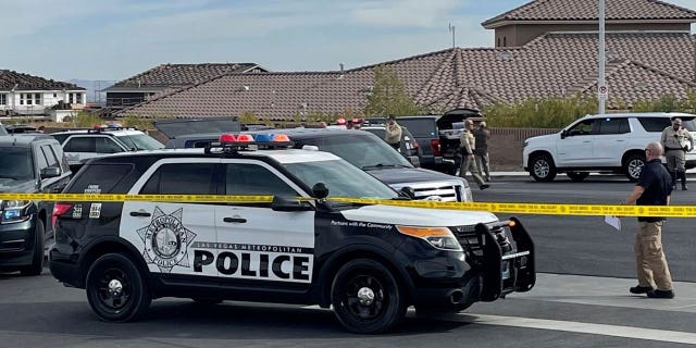 A SWAT team arrives to provide assistance as FBI agents negotiated with Matthew Beasley on March 3, 2022, in Las Vegas. Beasley was indicted Wednesday on federal charges that he orchestrated a $460 million Ponzi scheme.