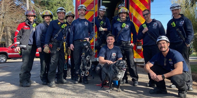 Firefighters posed with Tess near a emergency vehicle following the rescue.