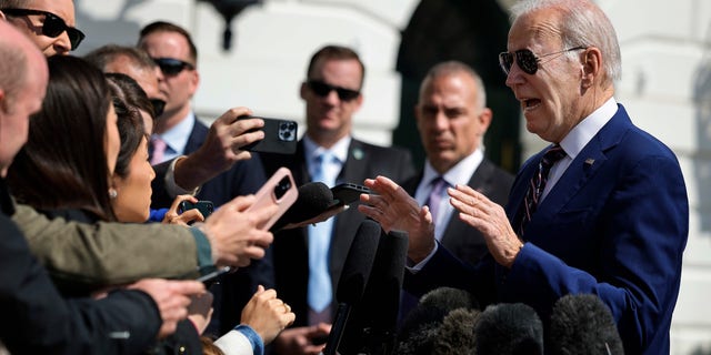 President Biden stops to briefly talk with reporters as he departs the White House on March 28, 2023, in Washington, D.C. Biden is traveling to Durham, North Carolina, to tour semiconductor manufacturer Wolfspeed Inc. and to deliver remarks on his administration's 'Invest in America' agenda.