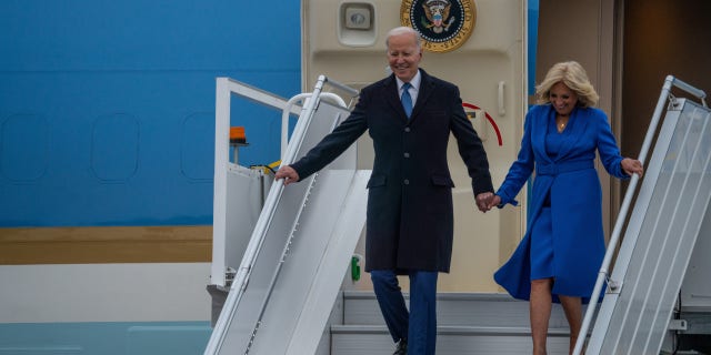 President Joe Biden walks down the stairs of Air Force One with first lady Jill Biden after arriving in Canada to meet with Prime Minister Justin Trudeau.