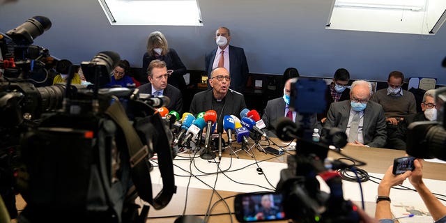 The President of the Spanish Episcopal Conference, Cardinal Juan Jose Omella, center, speaks during a press conference in Madrid, Spain, on Feb. 22, 2022. Spain’s ombudsman said March 13, 2023, that an independent commission has collected testimonies from 445 victims.