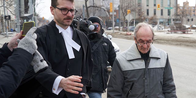 Retired priest Arthur Masse, 93, leaves the Law Courts in Winnipeg on March 30, 2023, after a judge acquitted him of forcing himself on a residential school student more than 50 years ago.