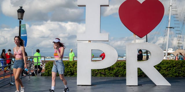 Tourists walk through the docking area of San Juan, Puerto Rico, on Aug. 3, 2021.