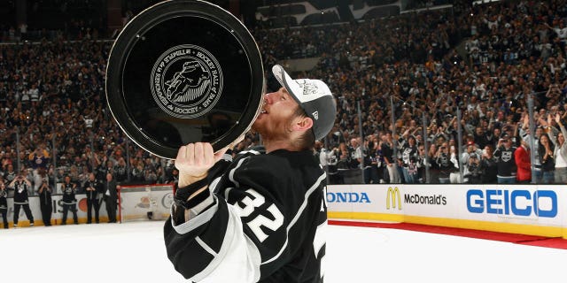 Goaltender Jonathan Quick of the Los Angeles Kings kisses the Stanley Cup after his team defeated the New York Rangers in Game 5 of the 2014 Stanley Cup Final at the Staples Center on June 13, 2014, in Los Angeles.