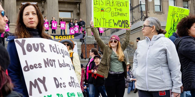 Boise, Idaho, residents show astatine a Planned Parenthood rally for termination rights connected May 14, 2022. However, Idaho lawmakers approved a measurement Thursday that would prohibition adults from taking minors to get an termination without parental consent.