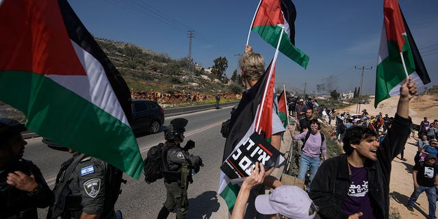 Israel Border Police officers prevent hundreds of Israeli leftist activists from organizing a solidarity rally March 3, 2023, in a Palestinian town that was set on fire by radical Jewish settlers on Sunday.