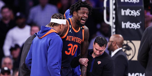 Julius Randle (30) of the New York Knicks walks after being injured during the second quarter of a game against the Miami Heat at Madison Square Garden on March 29, 2023 in New York City. 