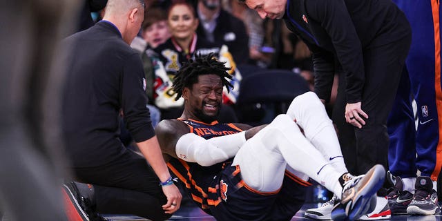 Julius Randle of the New York Knicks on the floor after getting injured during the second quarter of a game against the Miami Heat at Madison Square Garden March 29, 2023, in New York City. 