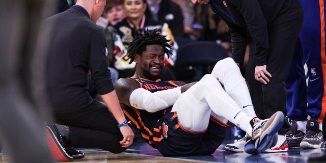 Julius Randle of the New York Knicks on the floor after getting injured during the second quarter of a game against the Miami Heat at Madison Square Garden March 29, 2023, in New York City.