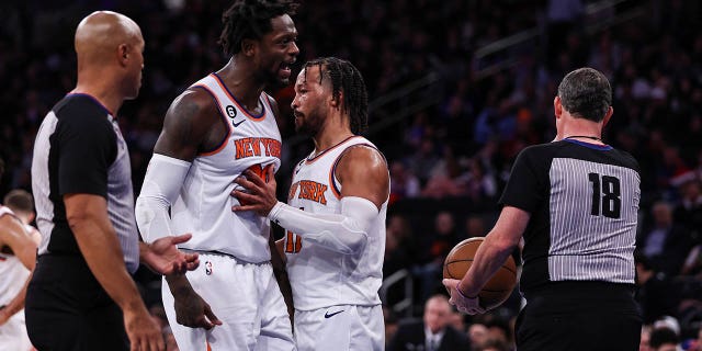 The Knicks' Jalen Brunson (11) restrains Julius Randle (30) as Randle argues with a referee after being ejected during the third quarter of a game against the Sacramento Kings at Madison Square Garden on December 11, 2022. 