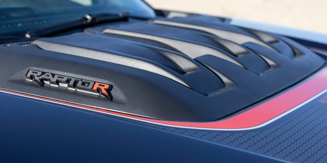 The Raptor R has a raised hood dome.