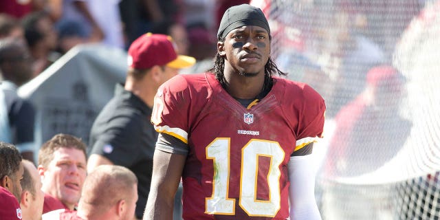 Football: Washington Redskins QB Robert Griffin III (10) on the sidelines during a game against the Cincinnati Bengals at FedEx Field. Landover, MD September 23, 2012