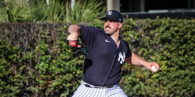 New York Yankees pitcher Carlos Rodon throws during practice before a spring training game against the Detroit Tigers at Steinbrenner Stadium in Tampa, Florida, on Feb. 27, 2023.