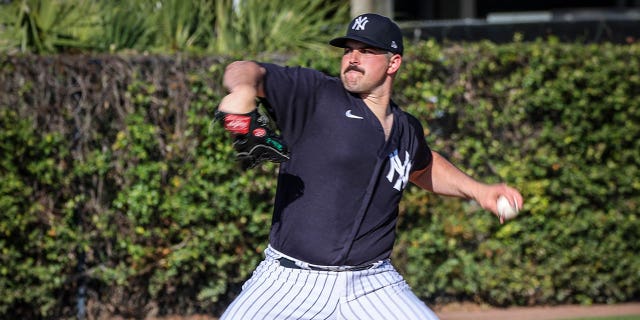New York Yankees pitcher Carlos Rodon throws during practice before a spring training game against the Detroit Tigers at Steinbrenner Stadium in Tampa, Florida, on Feb. 27, 2023.
