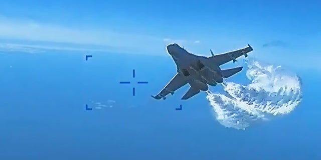 On Thursday, US European Command released video of a Russian Su-27 fighter jet colliding with a US MQ-9 Reaper drone over the Black Sea on March 14.  A screenshot shows a jet discharging fuel.