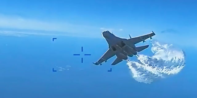 On Thursday, US European Command released video of a Russian Su-27 fighter jet colliding with a US MQ-9 Reaper drone over the Black Sea on March 14.  A screenshot shows a jet discharging fuel.