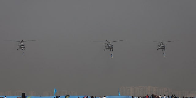 Indian Air Force's Mi-17 V5 perform in the air during the 89th Air Force Day parade, at Hindon Air Force Station in Ghaziabad, India, October 8, 2021. 