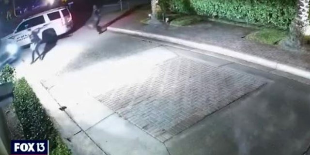 The second before a Sarasota police officer was hit by a vehicle being driven by a burglary suspect.