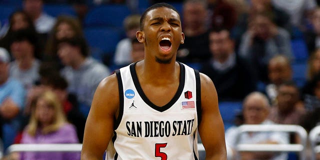 Lamont Butler #5 of the San Diego State Aztecs celebrates against the Charleston Cougars during the second half in the first round of the NCAA Men's Basketball Tournament at Amway Center on March 16, 2023 in Orlando, Florida. 