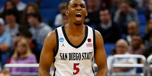 Lamont Butler #5 of the San Diego State Aztecs celebrates against the Charleston Cougars during the second half in the first round of the NCAA Men's Basketball Tournament at Amway Center on March 16, 2023 in Orlando, Florida.