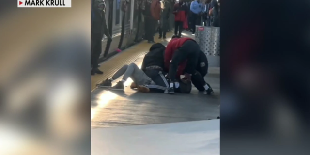 Cellphone footage captured by witness Mark Krull shows SEPTA passengers holding the suspect down before police arrived on the scene.