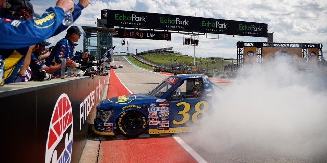 Smith held his truck in place against the pit wall.