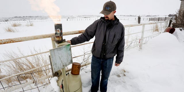 Eric Hjermstad, co-owner of Western Weather Consultants, adjusts the amount of silver iodide released near Breen, Colorado, on Jan. 15, 2016, with the hopes of increasing precipitation in a process called cloud seeing. 