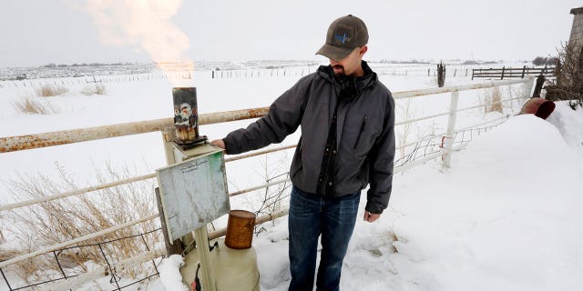 Eric Hjermstad, co-owner of Western Weather Consultants, adjusts the amount of silver iodide released near Breen, Colorado, on Jan. 15, 2016, with the hopes of increasing precipitation in a process called cloud seeing.
