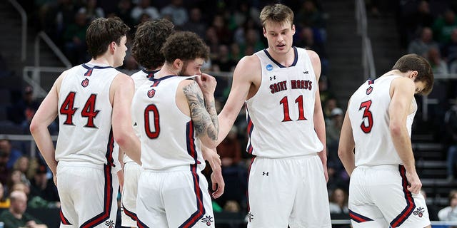 Mitchell Saxen (11) of the Saint Mary's Gaels reacts with teammates in the first half against the Virginia Commonwealth Rams during the first round of the NCAA Tournament at MVP Arena March 17, 2023, in Albany, New York. 