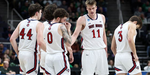 Mitchell Saxen (11) of the Saint Mary's Gaels reacts with teammates in the first half against the Virginia Commonwealth Rams during the first round of the NCAA Tournament at MVP Arena March 17, 2023, in Albany, New York.