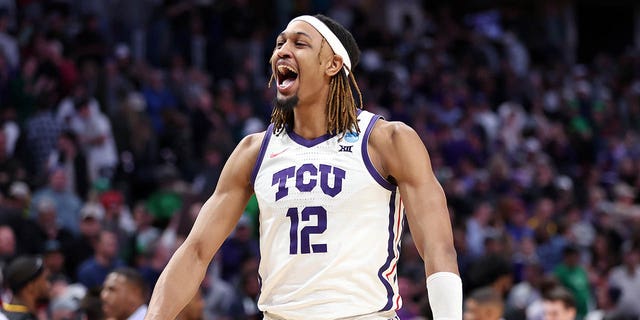 Xavier Cork #12 of the TCU Horned Frogs celebrates after defeating the Arizona State Sun Devils in the first round of the NCAA Men's Basketball Tournament at Ball Arena on March 17, 2023 in Denver, Colorado. 