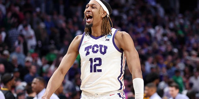 Xavier Cork #12 of the TCU Horned Frogs celebrates after defeating the Arizona State Sun Devils in the first round of the NCAA Men's Basketball Tournament at Ball Arena on March 17, 2023 in Denver, Colorado. 