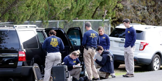 FBI investigators at Rancho Tehama Elementary School in the small community of Rancho Tehama, California, where a gunman killed several people earlier this morning on Tuesday Nov. 14, 2017, in Corning, California.