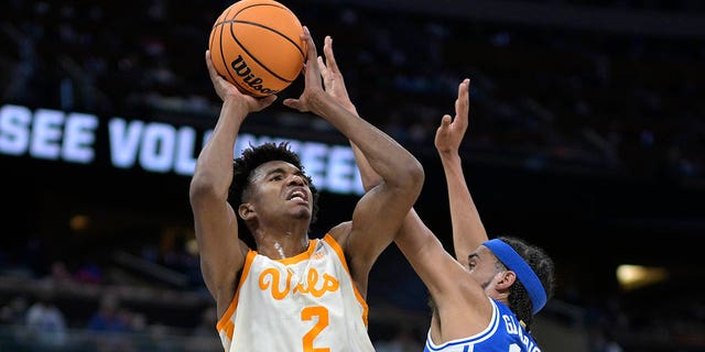 Tennessee forward Julian Phillips (2) shoots as Duke guard Jacob Grandison (13) defends during the first half of an NCAA Tournament second round game on Saturday, March 18, 2023 in Orlando, Florida.
