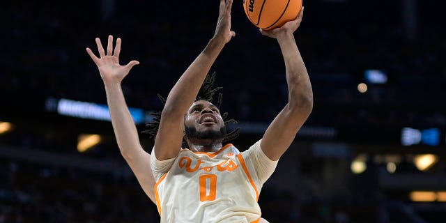 Tennessee forward Jonas Aidoo (0) shoots a shot in front of Duke center Ryan Young during the first half of an NCAA Tournament second-round game on Saturday, March 18, 2023, in Orlando, Florida. 