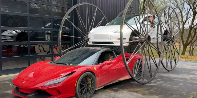The wheels lift it high enough to drive over other cars.