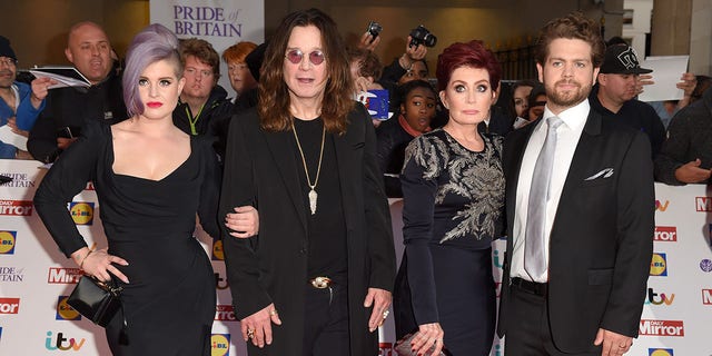 Kelly Osbourne, left, with father Ozzy Osbourne, shared the first glimpse of her baby in a photo with brother Jack, right. Her mother Sharon, second from right, was the first to announce earlier this year that Kelly had given birth.  