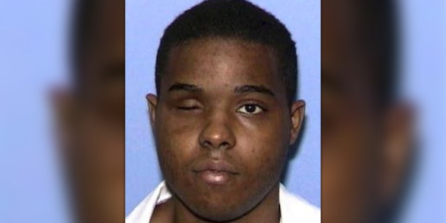 Andre Thomas during a booking photo with the Texas Department of Criminal Justice after he gouged out one of his eyes.
