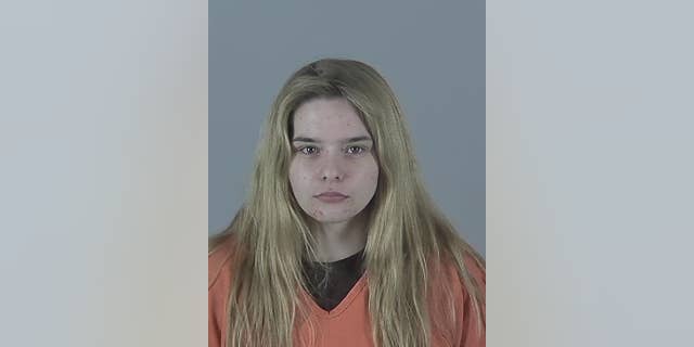 Alexis Elling, 21, was accused of helping her boyfriend hide the body of a man he allegedly killed.