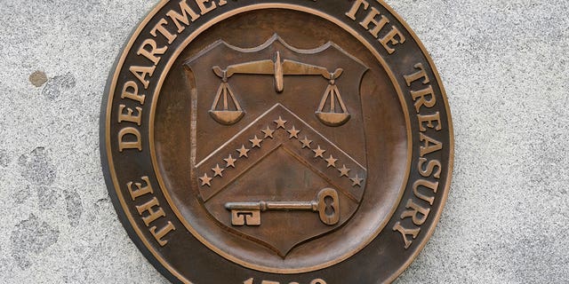 The Department of the Treasury's seal is seen in Washington on May 4, 2021. The United States slapped more sanctions on people and firms associated with Iran’s drone procurement and illicit banking network used to conceal transactions. 