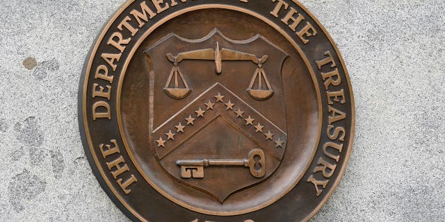 The Department of the Treasury's seal is seen in Washington on May 4, 2021. The United States slapped more sanctions on people and firms associated with Iran’s drone procurement and illicit banking network used to conceal transactions.
