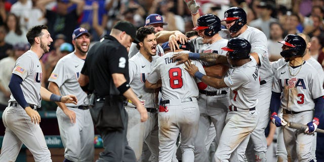 Members of Team USA celebrate after Trea Turner #8 hit a grand slam in the eighth inning during the 2023 World Baseball Classic Quarterfinal game between Team USA and Team Venezuela at loanDepot Park on Saturday, March 18, 2023, in Miami, Florida.