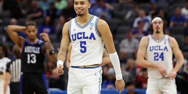 UCLA Bruins' Amari Bailey #5 reacts during the second half of a game against the North Carolina-Asheville Bulldogs in the first round of the NCAA Men's Basketball Tournament at Golden 1 Center on March 16, 2023 in Sacramento, California. 