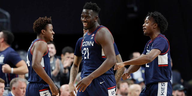 Adama Sanogo #21 of the Connecticut Huskies reacts during the second half against the Gonzaga Bulldogs in the Elite Eight round of the NCAA Men's Basketball Tournament at T-Mobile Arena on March 25, 2023 in Las Vegas, Nevada. 