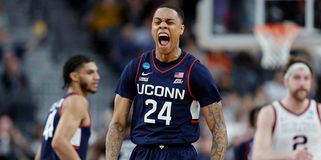 Jordan Hawkins #24 of the Connecticut Huskies celebrates after making a three point basket during the second half against the Gonzaga Bulldogs in the Elite Eight round of the NCAA Men's Basketball Tournament at T-Mobile Arena on March 25, 2023, in Las Vegas, Nevada. 