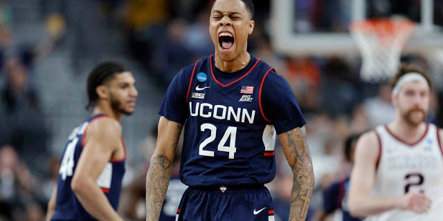 Jordan Hawkins #24 of the Connecticut Huskies celebrates after making a three point basket during the second half against the Gonzaga Bulldogs in the Elite Eight round of the NCAA Men's Basketball Tournament at T-Mobile Arena on March 25, 2023, in Las Vegas, Nevada.