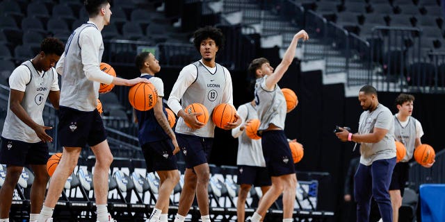 Richie Springs (13) of the Connecticut Huskies practices with his team at T-Mobile Arena March 22, 2023, in Las Vegas.
