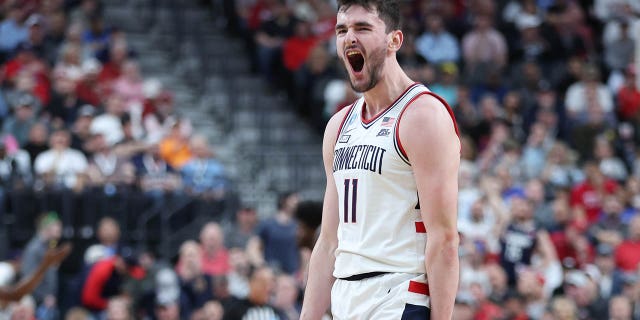 Alex Karaban #11 of the Connecticut Huskies reacts after a touchdown during the first half against the Arkansas Razorbacks in the Sweet 16 round of the NCAA Men's Basketball Tournament at T-Mobile Arena on March 23, 2023 in Las Vegas, Nevada . 